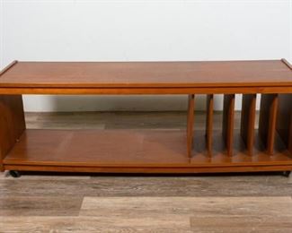 223	Mid Century Modern Stereo Console	Mid Century Modern stereo console. Mid 20th Century. Teak, pressboard, dowel pegs, wheeled feet, file dividers. Damage and exposure to pegs on dividers, wear to top. 19 1/2" H x 55" L x 15 12" D
