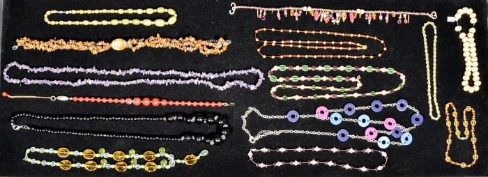 282	Grouping Of Vintage Mid Century Necklaces	14 Mid Century necklaces. Amethyst, cat's eye and more. Longest necklace (amethyst) 42"
