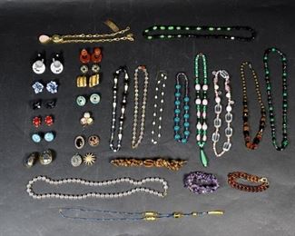 284	Grouping Of Vintage Jewelry	12 bracelets, 10 pairs of earrings, 3 bracelets and 5 brooches. Including AJS Design and Ciner. Longest necklace (clear spherical beads) 31"
