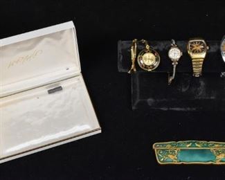 285	Collection of 4 Wristwatches and Enameled Comb	4 wrist watches. Mens Seiko Sport Diver 70m 6106-8100 wrist watch circa 1968, in working condition. Seiko Quartz 4303-7009 ladies wrist watch. Lady Elgin 14k Gold filled ladies wrist watch. Bucherer ladies enameled pocket watch on chain. Bucherer Ladies watch: 16 1/2" Length. Also included is a gilt and enamel hair comb, marked 'Made in Italy'.
