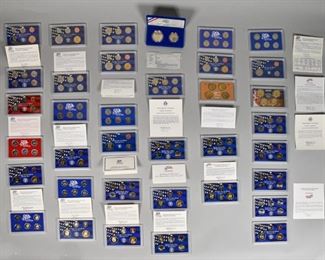 293	Grouping of United States Proof Sets	Grouping of United States Proof Sets. American, 1999 to 2008. There are 20 sets total, including three 50 State Quarters Proof Sets from 2003, 2004 and 2007, a silver proof set from 2002, a Liberty coin set from 1986, and proof sets from 1999 to 2008. All sets are still in original boxes with the exception of a second 1999 proof set. Some slight wear to all boxes. 1" H x 5 1/2" L x 3 1/2" D
