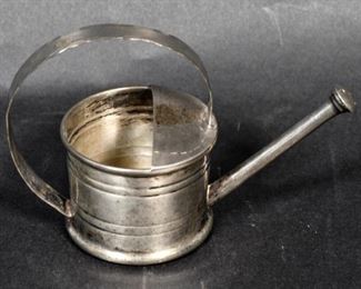 314	Cartier Sterling Watering Can Vermouth Infuser	Cartier (France, 1847-). Sterling silver watering can vermouth infuser. Marked Cartier Sterling on the underside. 3 1/4"H; 50.2 grams.

