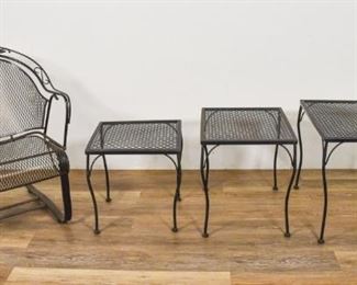 321	Woodard Briarwood Style Chair and Tables	Woodard Briarwood style chair and three nesting tables. American, Late 20th Century. Black metal and decorative florets. Rust and oxidization present. 34" H x 25 1/2" L x 26" D
