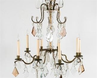 387	Louis XV Style Rock Crystal Chandelier	Louis XV style chandelier with rock crystal lusters. 8 lights. With extra prisms. 31 1/2"H x 24"-diameter.
