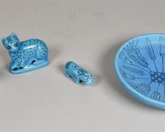 390	4 Pieces Egyptian Faience Reproduction Porcelain	Grouping of 4 Egyptian faience replica pieces. American, Late 20th Century. An Egyptian faience bowl with description card, two William the Hippos, and a spotted cat. Bowl marked MMA 1986 on bottom, cat and smaller hippo marked BMPL, and larger hippo marked MMA. Bowl measures 2" H x 8" diameter
