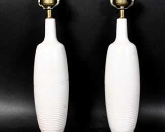395	Pair of White Pottery Mid 20th Century Lamps	Pair of mid 20th century lamps. Loss to the lamp bases. 17 3/4" Height.

