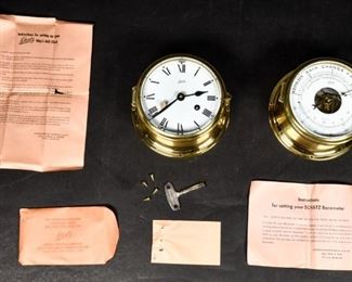 397	Schatz Ship's Bell Clock and Barometer	Schatz Ship clock and barometer. German, Mid 20th Century. Brass, Roman numerals, and mechanics. Barometer marked "Made in Germany" and "HOLOSTERIC COMPENSATED BAROMETER." With original instructions and envelope containing key and screws. Clock measures 4" H x 7" diameter
