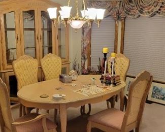 Dining room table, includes leaf. Seats 6-8. Matching China hutch. Framed prints/pictures 