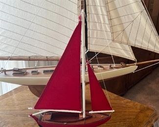 Small red sailboat