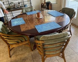 Golf motif dining table, 5' diameter; 4 rattan chairs