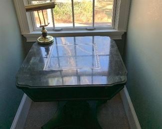 Marble-topped game table. Center is reversible and has a checker/chess board on it.