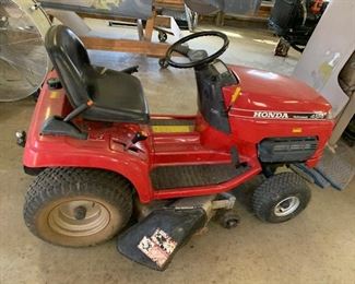 Honda hydrostatic riding lawn mower; cranked it up and it works. It has a Water cooled engine. Pull behind accessories also available.