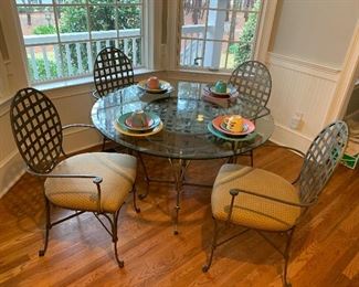 Round glass table with 4 chairs