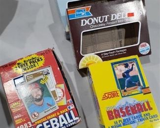 Empty baseball card boxes. Each box has a variety of baseball cards on the outside of them. Please see pix