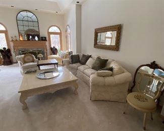 Wrap around sofa, antique mirrors, marble coffee table 