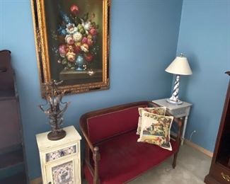 Antique oil painting, antique settee, decorative pillows, nautical theme lamp