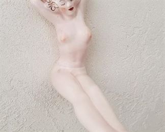 This is a very interesting piece...Hooks on the wall so we assume it's a piece to hang your clothes on...