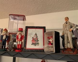 Vintage gum ball machine, Christopher Radko signed ornament, antique Henry Ford decanter still full, nutcrackers 