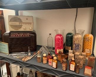 Antique pharmaceutical bottles, syringes, RCA and Emerson radio