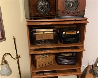 Barrister book case, multitude of antique radios (zenith, sentinel, Emerson, General Electric)