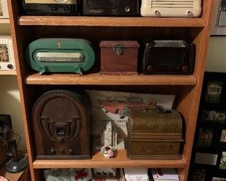 Book case / display shelf, Edison cylinder player, Philco cathedral radio, tube radios, mid century