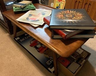 Mid century coffee table, coffee table books, Saturday evening post magazines from the 20’s and 30’s (stacks of different vintage magazines), vintage mustang posters