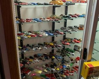 Multitude of vintage toy cars and trucks, matchbox, dinky, tootsietoy, corgi, budgie, and many more models