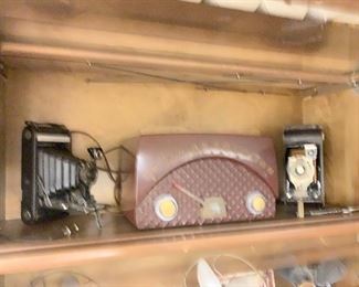 Vintage cameras, bakelite tube radio 
