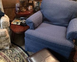Pair of extremely comfortable blue arm chairs with leather ottomans 