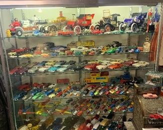 Store display case, fat man swing away steering wheel, national cash register, dealer promo models, liquor decanters, avon, dinky cars, tootsie toys, matchbox, Disney
