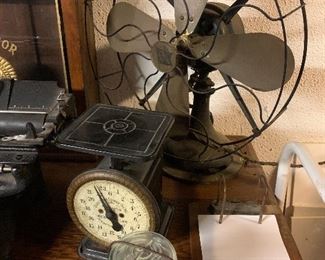 Antique scale, brass fan, marbles