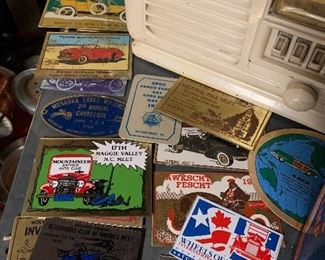 Antique automotive event dash plaques spanning over 5 decades 