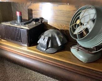 RCA record player, miners hat, mid century fan