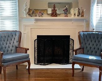 Lewittes' tufted armchairs with cane sides; fireplace screen