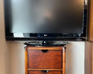 LG 47" flat screen tv; wood filing cabinet
