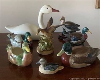 One Wooden Swan Among Seven Ceramic Duck Figurines Including an Andrea by Sadek