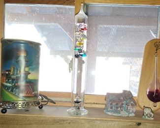 Galileo thermometer-$40.00 each/rotating train lamp=$175.00