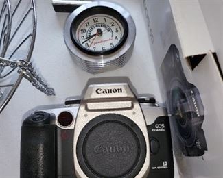 Camera-$40.00, Harley Davidson clock-$30, small clock-$20