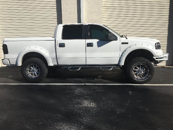 Custom Ford F-150, lift kit, 82,000 miles , new transmission , flair fenders, Bed liner , bed cover, CD -Video player, NO FLUID LEAKS , runs great! $ 9,500. Or best offer 