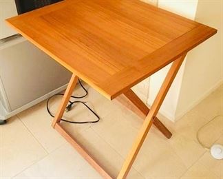 Teak-wood portable table is $45:  21" wide, 2' long, 25" tall. (j)