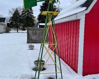 John Deere wind mill about 8 feet tall