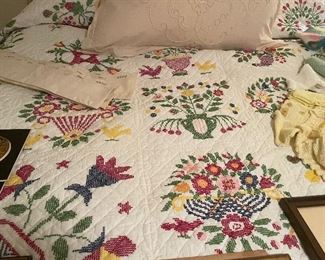 Several cross stitch handmade quilts