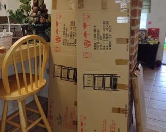 Two new in box baker's racks