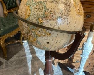 Globe with wood stand and brass claw feet