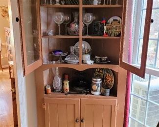 One of two matching pine corner cupboard