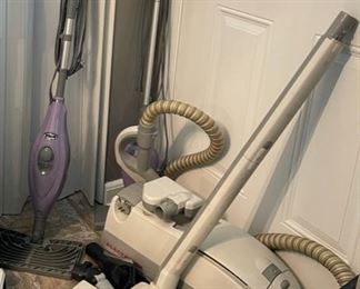 two Shark steamer mops, Electrolux canister vacuum, Hoover vacuum