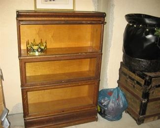 Old oak Stacked Bookcases and to right is Santas black bag