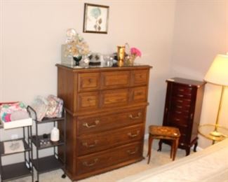 Chest of drawers, jewelry cases, glass and brass floor lamp.