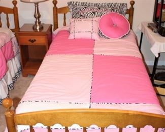 Twin beds with fun pink bedding.