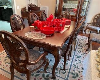Beautiful dining table with 2 leaves and 10 chairs.